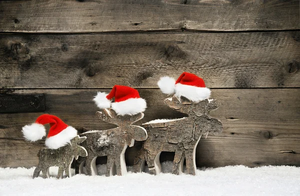 depositphotos 57080429 stock photo three reindeer wearing santa hats